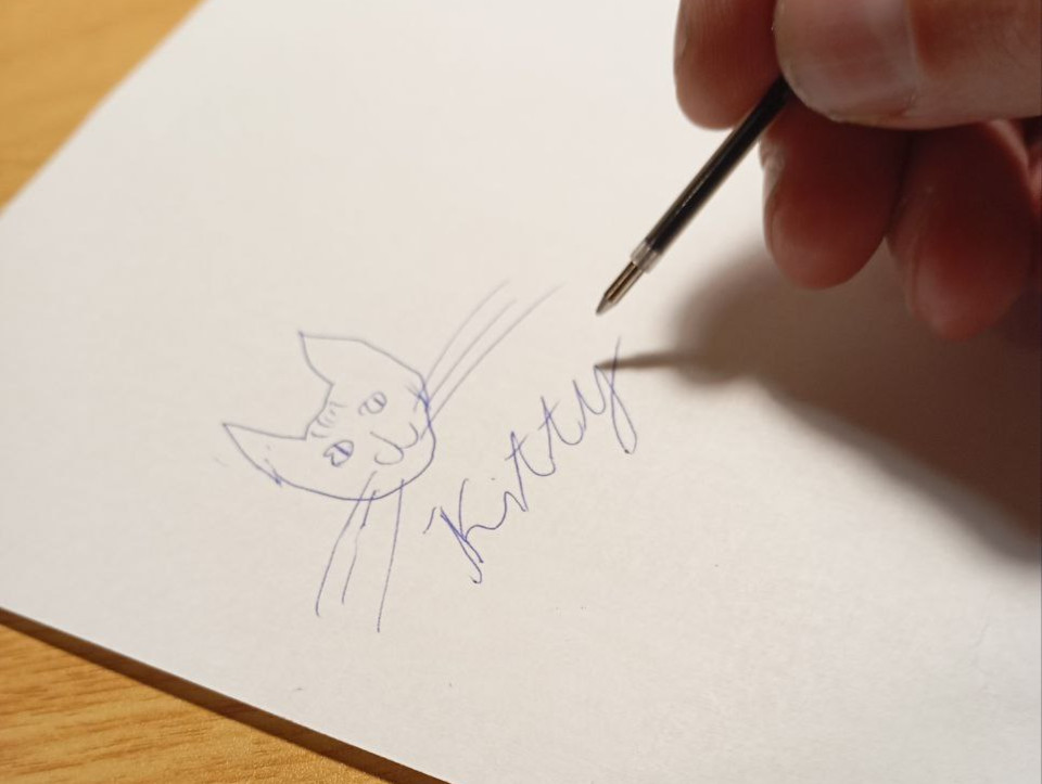 Drawing kitty with pen-refill